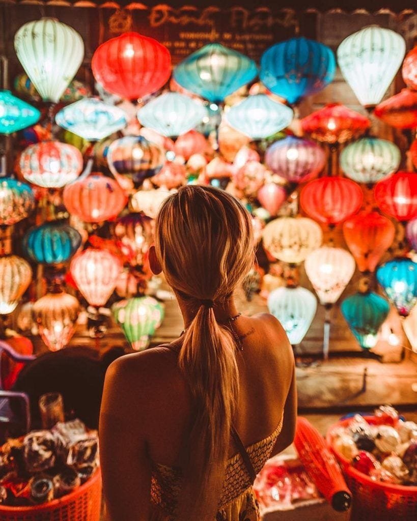 Girl standing under the lanterns in Hoi An Old Town