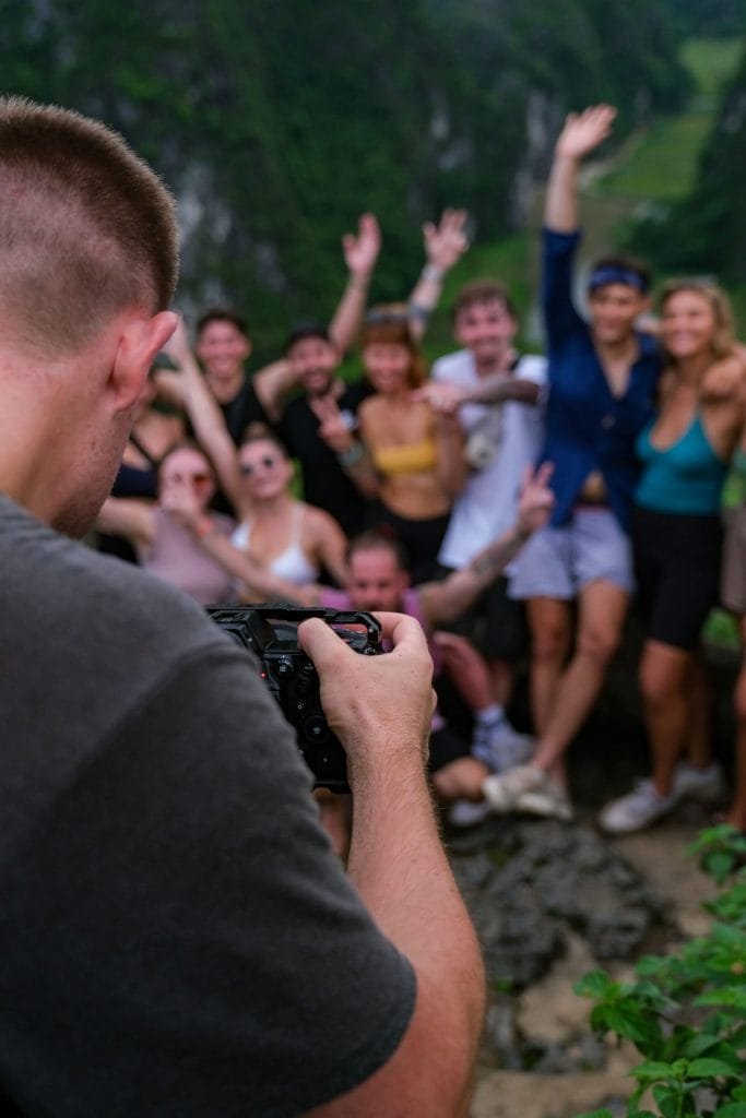 Guy taking a group photo