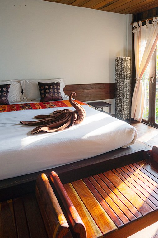 A picture of a swan made out of towels on a bed in Bali. 