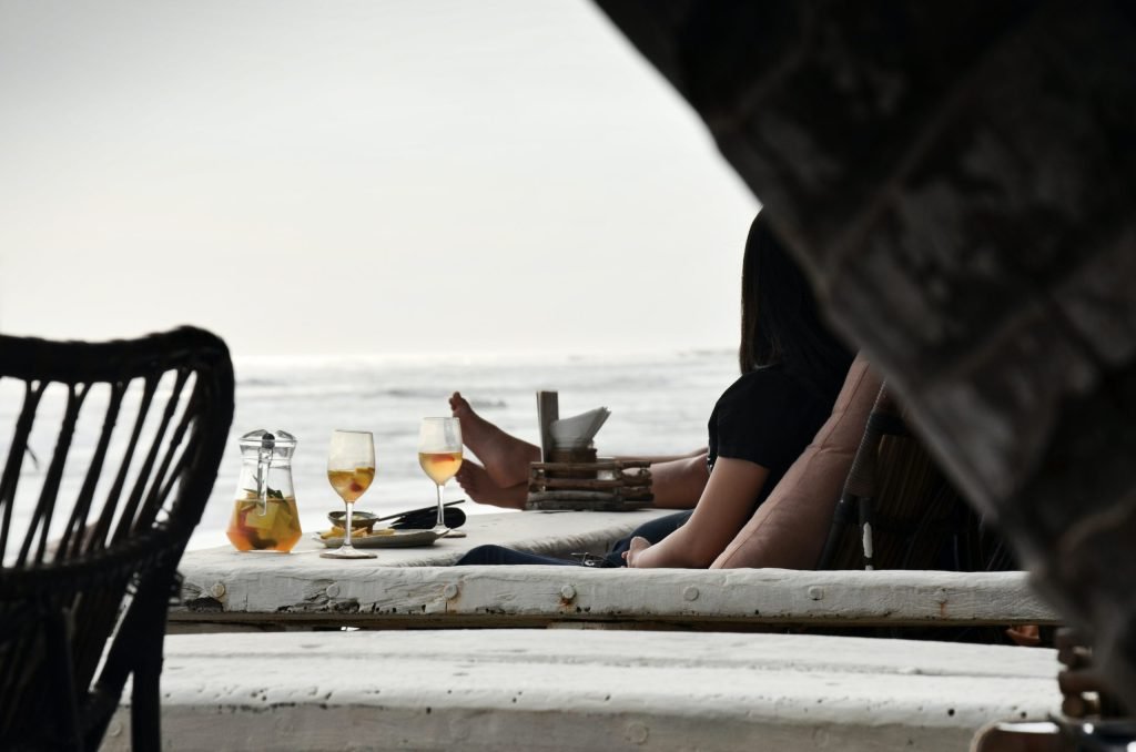 A picture of some drinks by the sea in Bali. Is Bali expensive? Alcohol is a big factor.