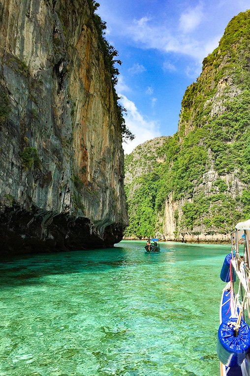 A picture of some dramatic limestone caves against the water of the Phi Phi Islands.