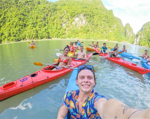 Kayak around the limestone islands & caves of Halong Bay